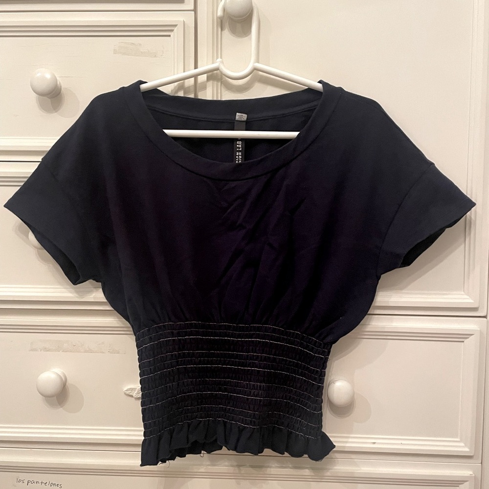 Navy blue stylish tee with stretchy colorful ribbed stripes at the bottom